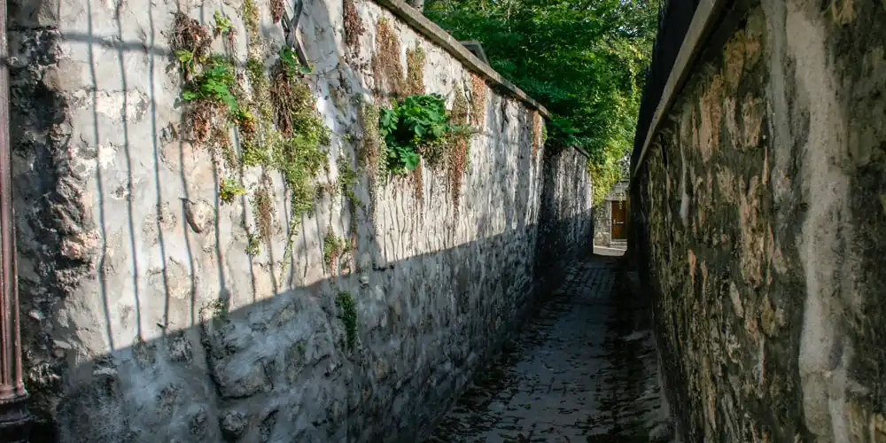 Narrow stone passage in the 16th arrondissement of Paris