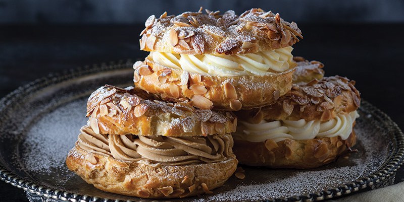 Three typical Parisian patisseries on a metal tray