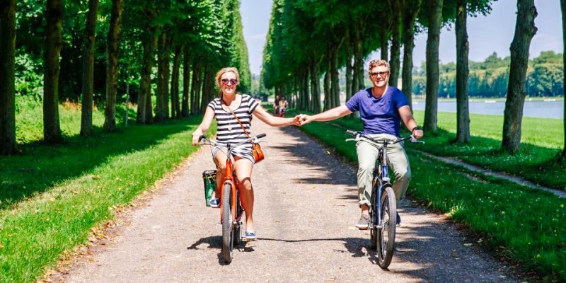 Holding hands while biking through Versailles: perhaps not recommended, but very romantic