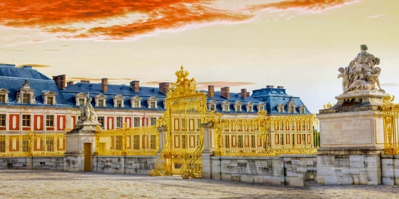 Gilded gates surround the Chateau de Versailles