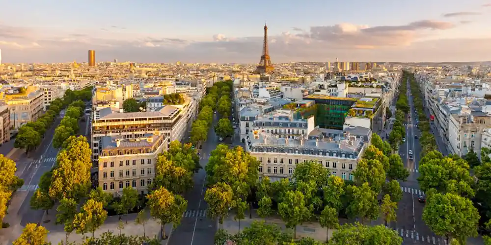 A view over the Paris rooftops features the Eiffel Tower and TOur Montparnasse
