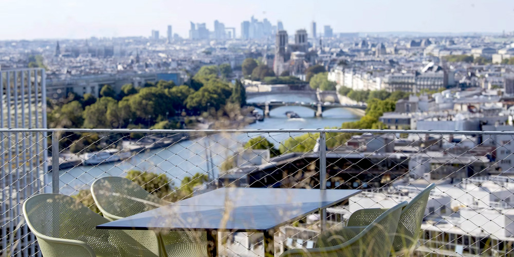 The Seine river and Notre dame spread out before you from the rooftop at Laho