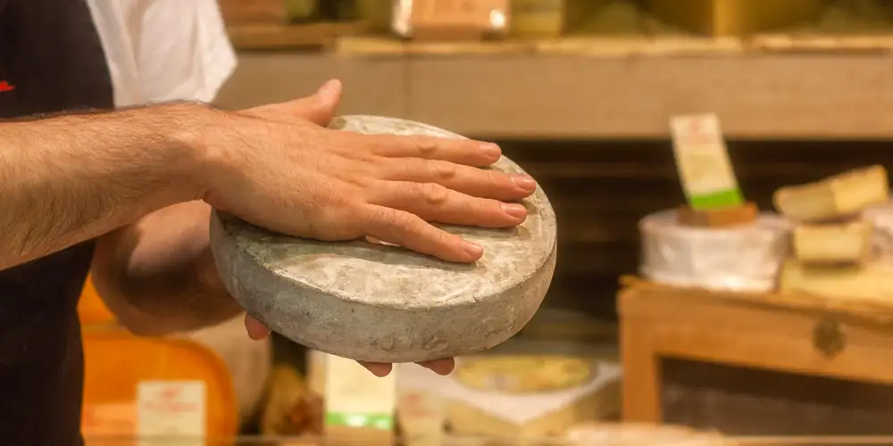 A fromager presents his favorite cheese, photo by Mark Craft