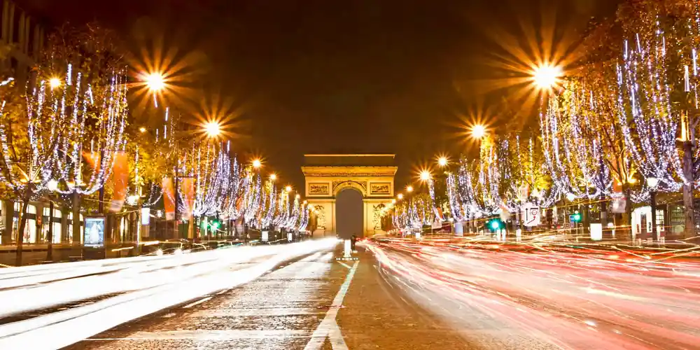 Christmas lights on the Champs-Élysées with the Arc de Triomphe