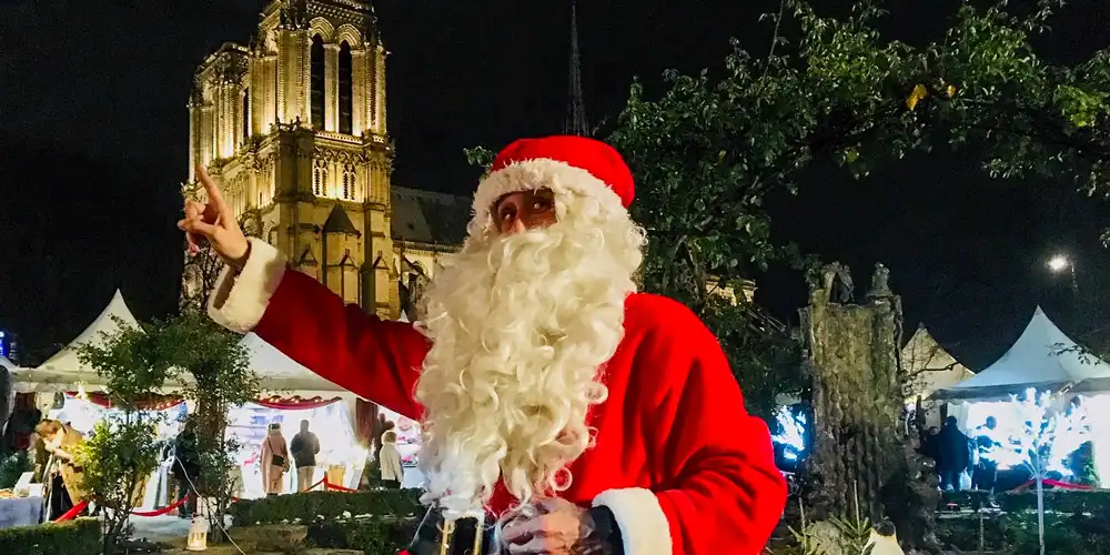 Pere Noel makes an appearance at the Notre Dame Christmas market