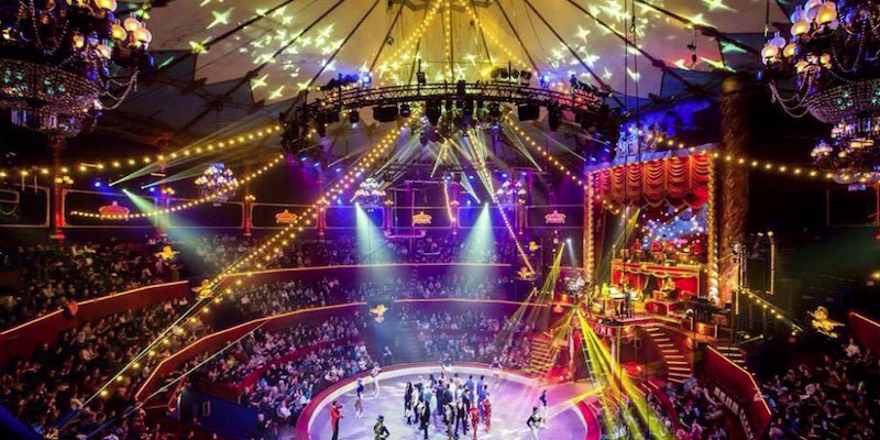 Colorful lights create a festive atmosphere under the tenr of Cirque d'Hiver