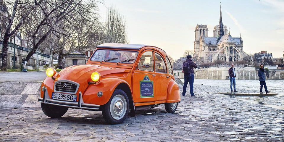 A Citroen 2CV on the banks of the Seine near Notre Dame