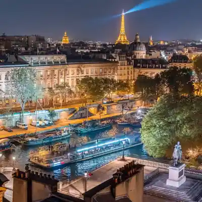Seine dinner cruise passing Île de la Cité at night