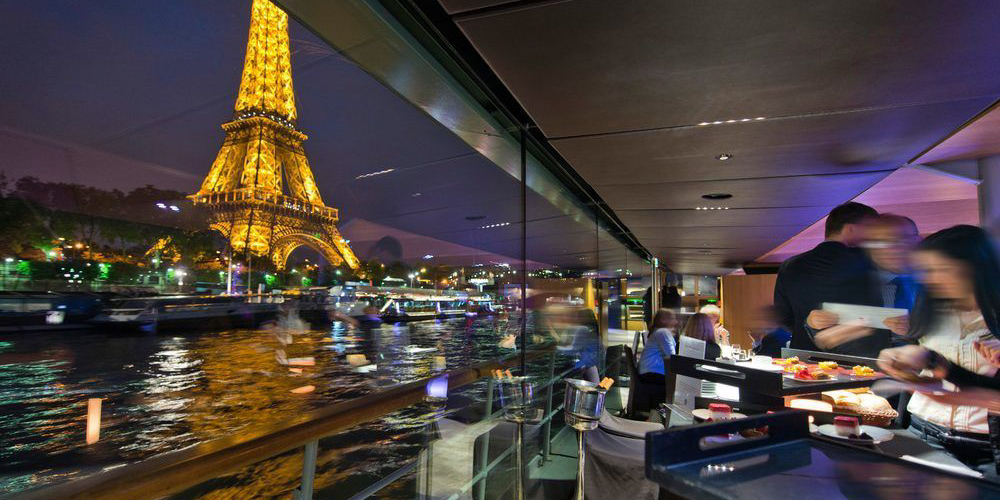 The bateau's glass wall gives you the best view of Paris at night