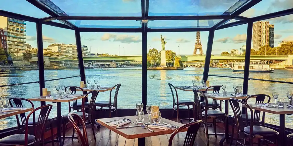 The Eiffel Tower and Statue of Liberty seen from the Paris Seine lunch cruise