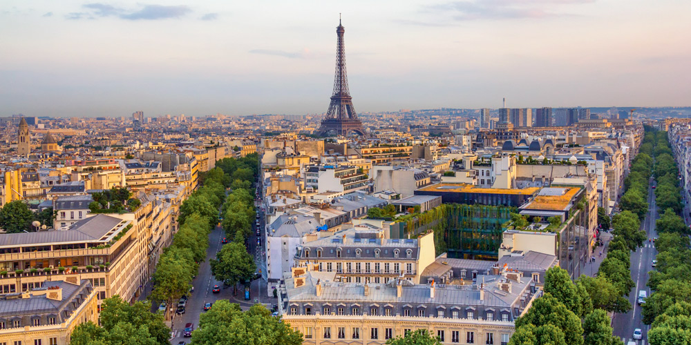 The Eiffel Tower, the iconic symbol of Paris, towers over the city