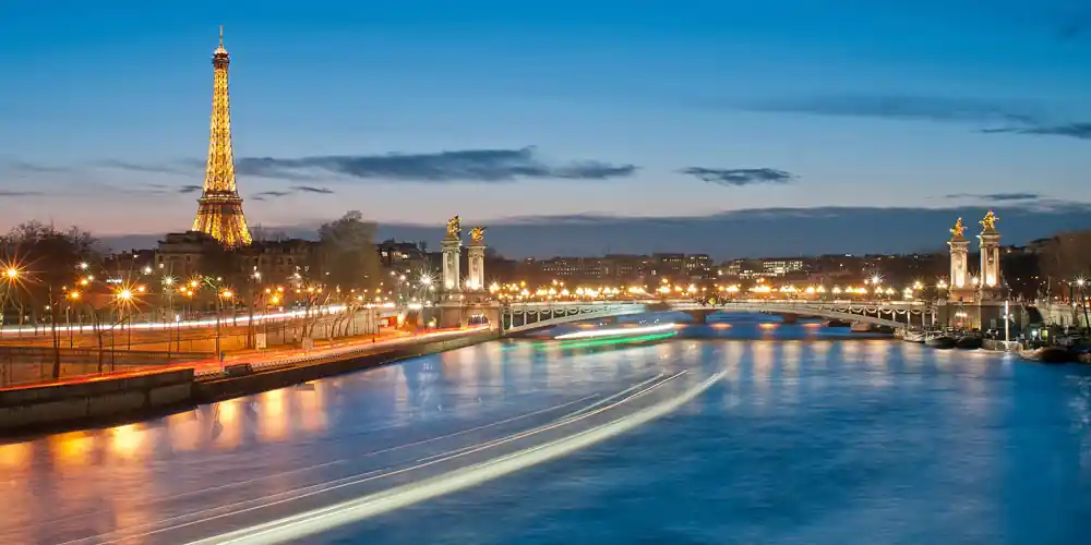 Eiffel Tower and Pont Alexandre III at dusk in Paris