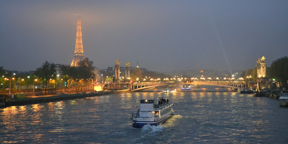 Bastille Day Dinner Cruise, Bateaux ply the River Seine beneath the Eiffel Tower