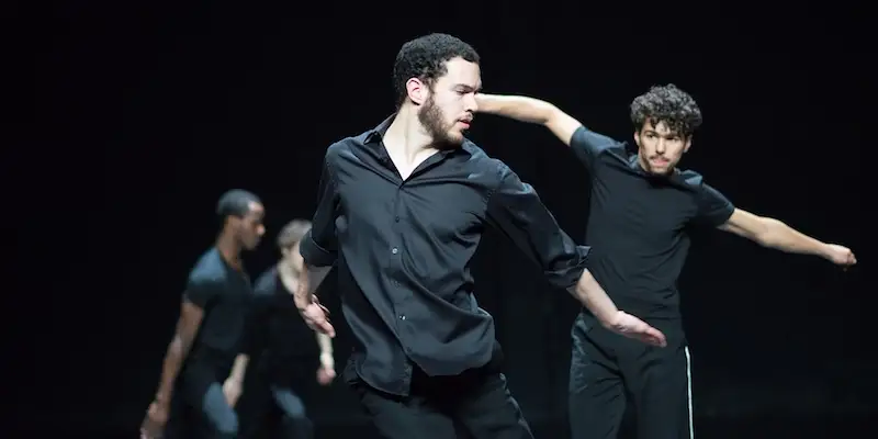 Men performaing a dance number as part of Le Festival d'Automne