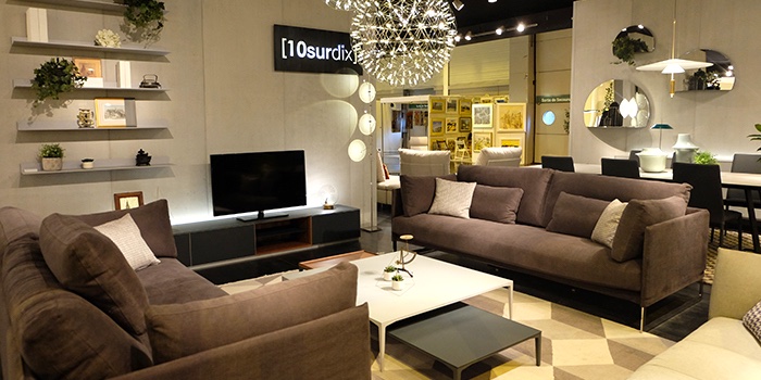 A living room set with two sofas in brown suede on display at the Salon de l'Habitat