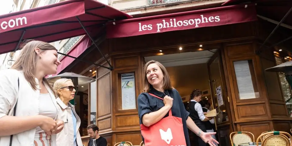 Visitors on a private food tour of a Paris neighborhood