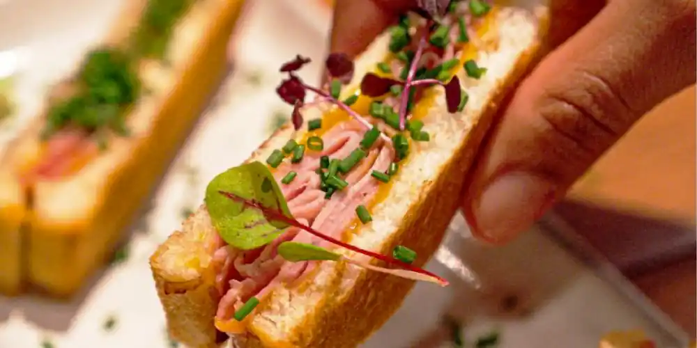 A tour guide leads a tasting during a champagne & Food Tour in Paris