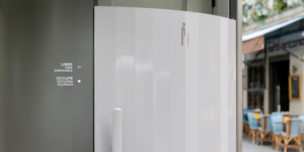 The contrasting color of the door of this public toilet makes it easy to spot.