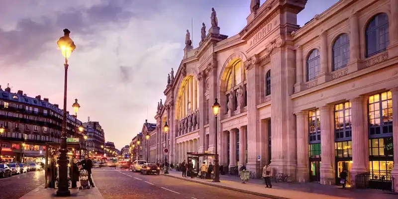 The facade of Gare du Nord at sunset
