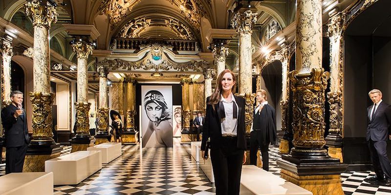 In the Hall of Columns, celebrity waxworks stand among gilded details