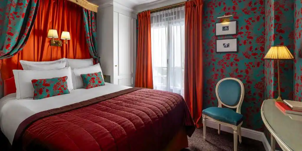 A room at Hotel de Buci in rich red tones