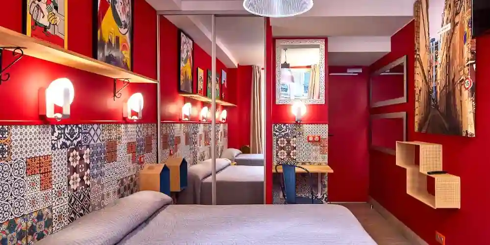 A colorful palette and mirrors open up the compact rooms of Hotel de Roubaix