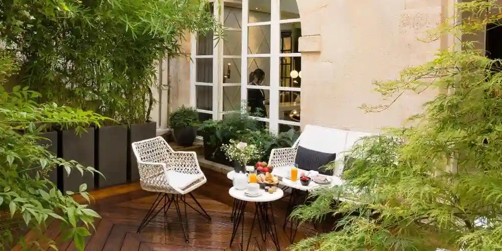 The leafy courtyard of the Millesime Hotel