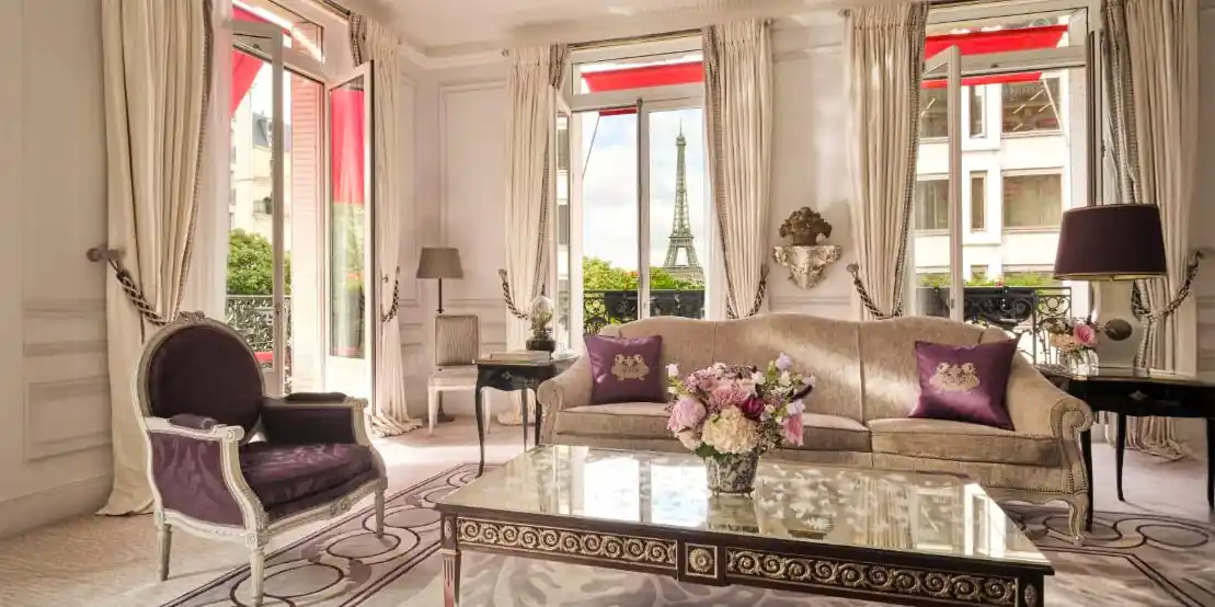 A suite at Plaza Athénée with views of the Eiffel tower and the signature red awnings