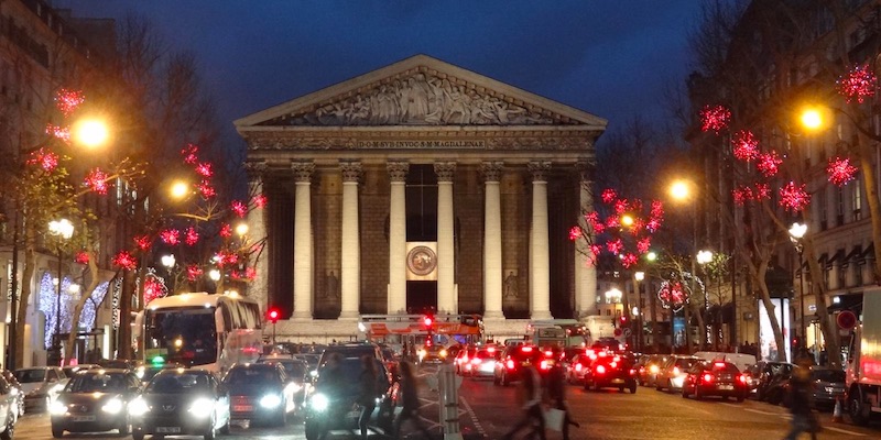 glise de la Madeleine with Rue Royale adorned with festive lights