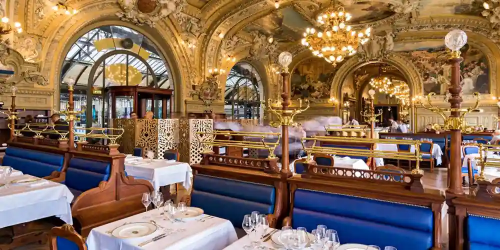Sumptuous detailing of gold-plated ceilings at Le Train Bleu