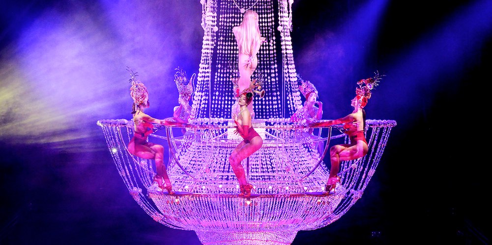 Lido Paris dancers in a giant champagne glass
