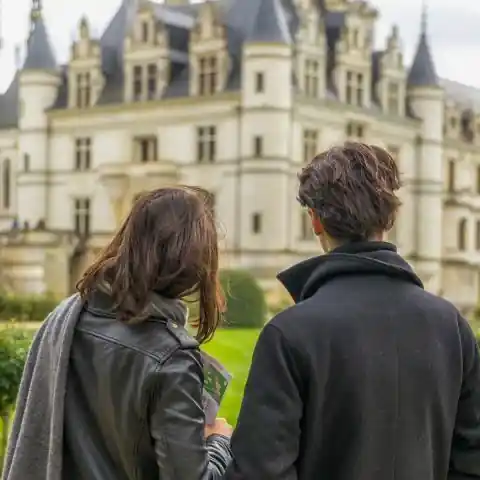Couple visiting Chateau de Chenonceau in the Loire Valley on a day trip from Paris