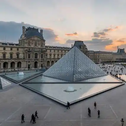The Louvre courtyard with glass pyramid in Paris