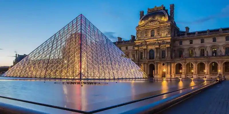 The Louvre and the Pyramid lit up at night
