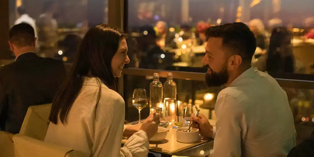 A couple at a Valentin's Day table with a view at Madame Brasserie
