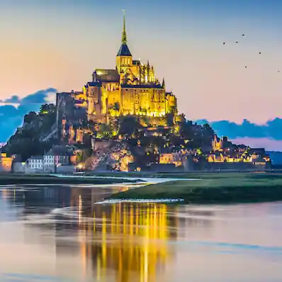 Mont Saint-Michel at dusk with reflection in Normandy