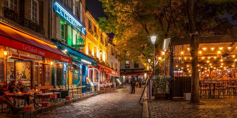 Restaurants and cafes line the Place de Tertre in this nighttime shot