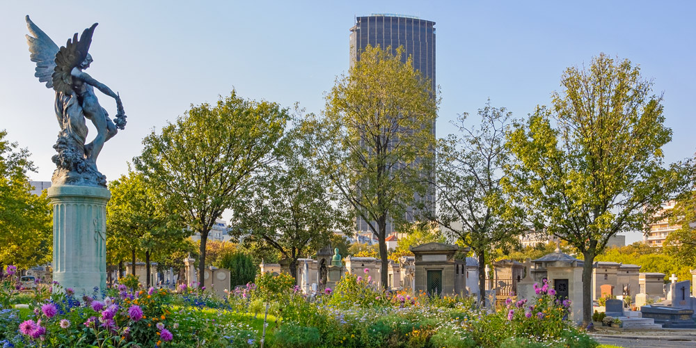 An 1889 bronze statue by Horace Daillion at Montparnasse Cemetery, with Tour Montparnasse in the background