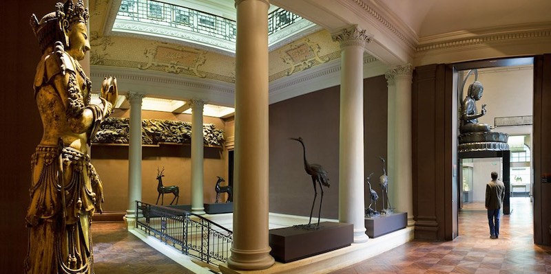 The atrium at Musée Cernuschi with the huge statue of Buddha in the background