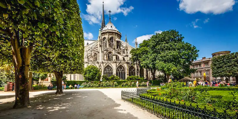 The garden of Notre Dame with a view of the cathedral's flying buttresses