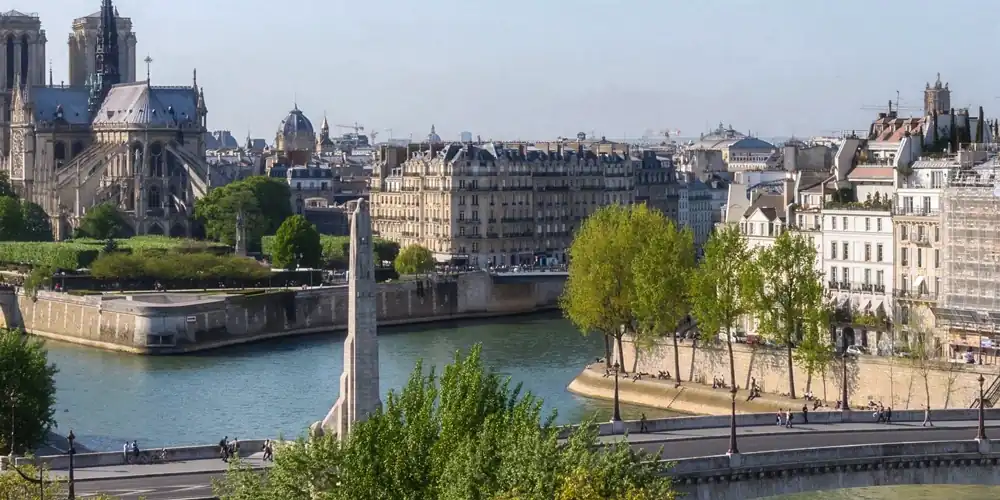 Notre Dame, statue of Geneviève, Pont Sully, and Île Saint-Louis, photo Hotel Saint Louis en Isle