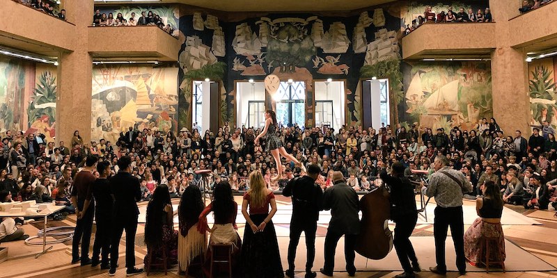 Musician play, an acrobat peforms inside a Paris museum as the audience watches during Nuit des Musée
