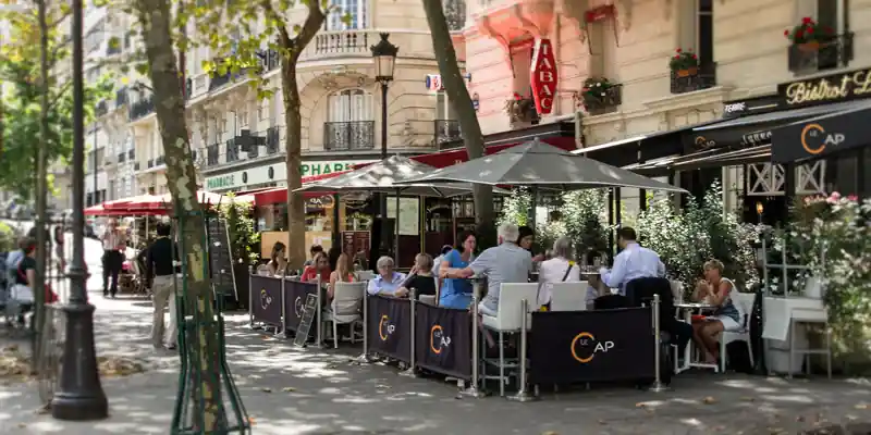 Café terrace with people dining in the 15th arrondissement, photo by Mark Craft