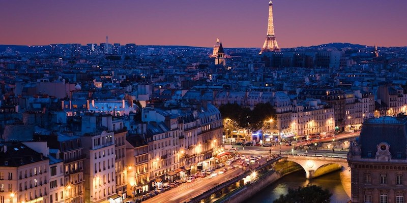 The Tour Eiffel towers over Paris, seen from the Notre Dame bell towers