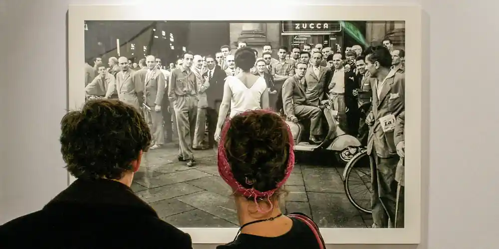 Visitors viewing a large photograph at Paris Photo
