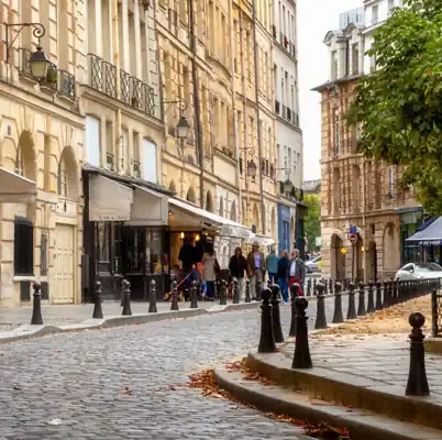 Café and cobblestone street in Place Dauphine in Paris