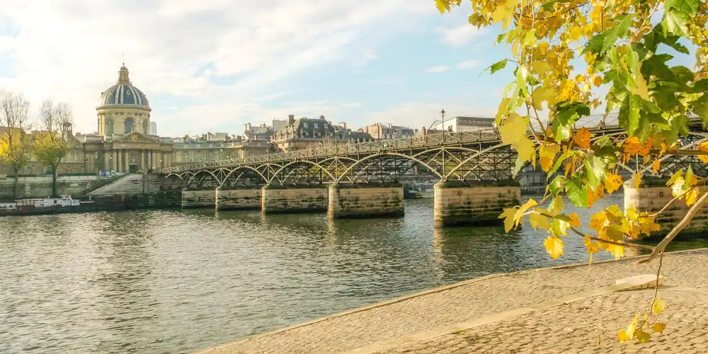 Pont des Arts, connecting the Louvre and the dome of the Institut de France, photo by Mark Craft