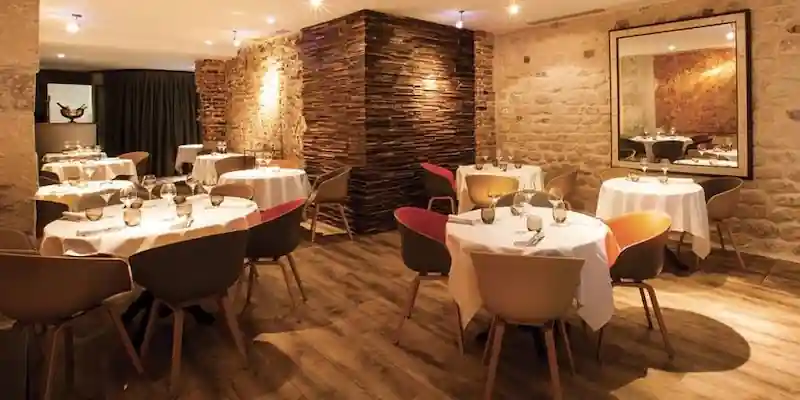 Intimate Michelin-star restaurant dining room in Paris