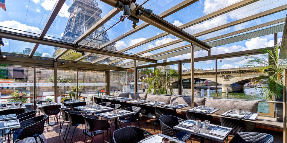 Tables set for a bistro lunhc on a boat from Le Bistro Parisien