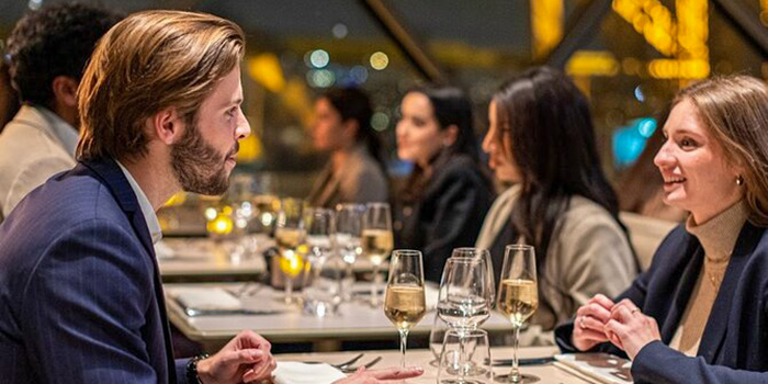 A couple have Dinner on the Eiffel Tower at Madame Brasserie